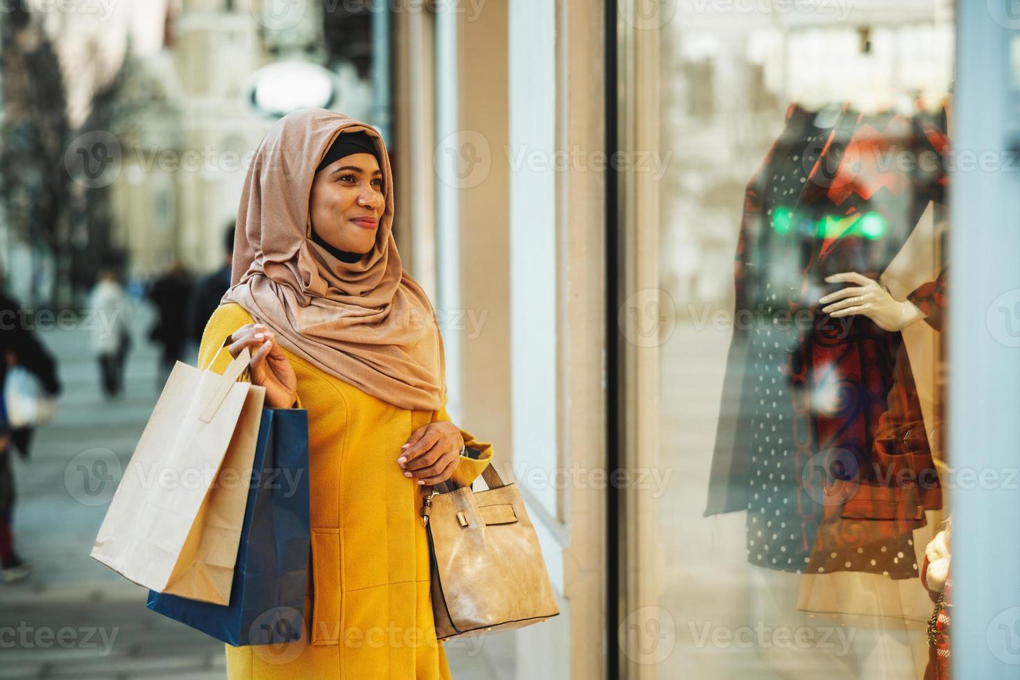 Black Muslim Woman With Hijab In The Shopping photo