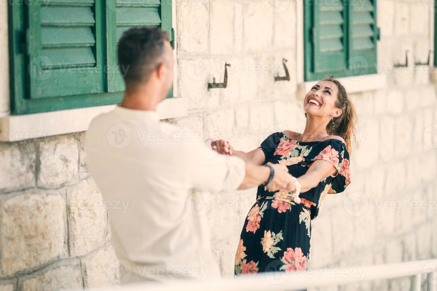 Couple Dancing In The City At Summer Vacation photo