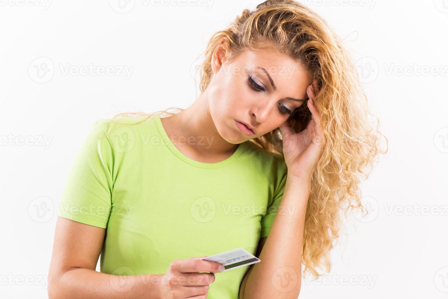Disappointment girl with credit card photo