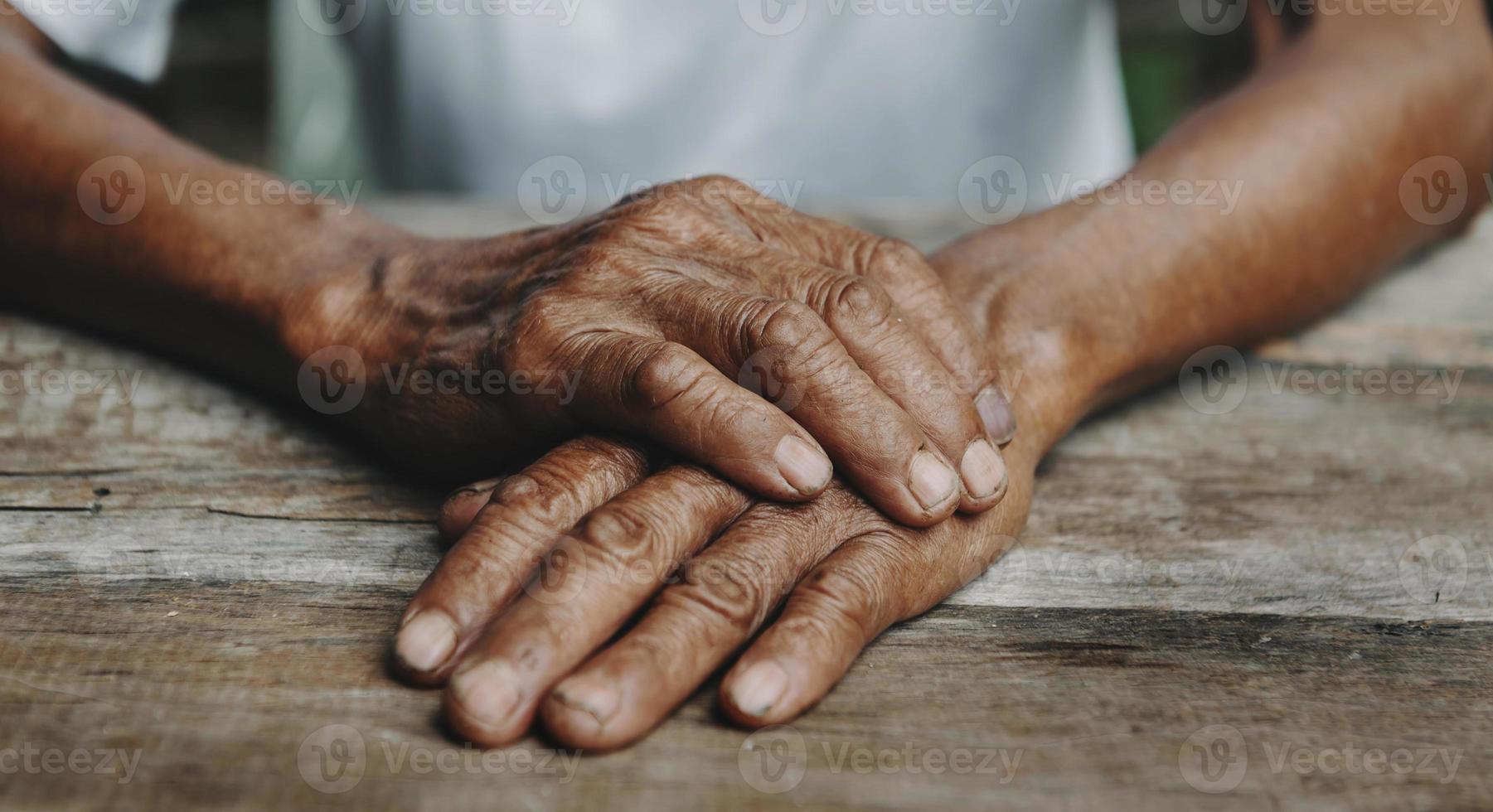 Male wrinkled hands, old man is wearing photo