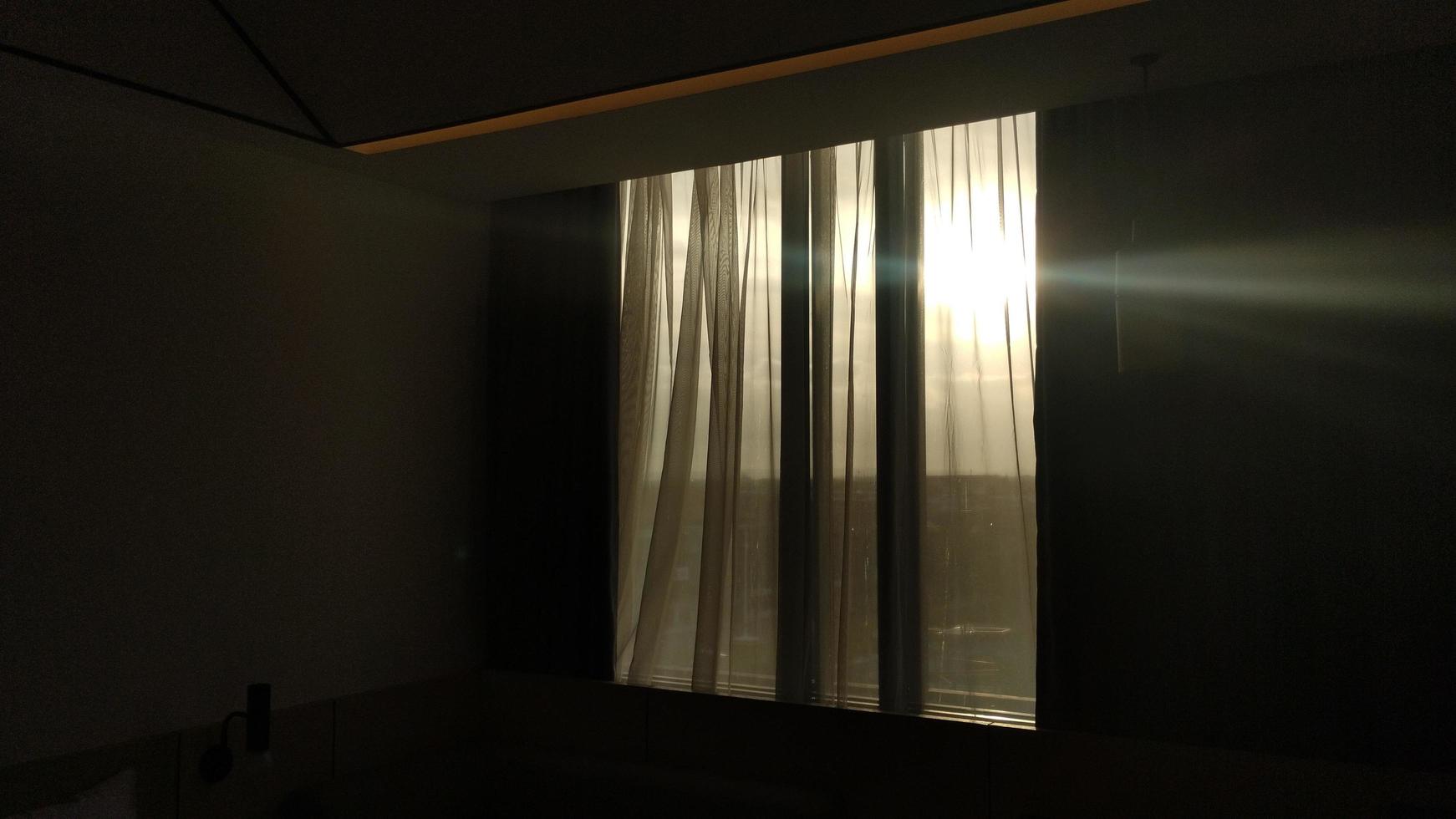 dark hotel room with yellow bulb light photo