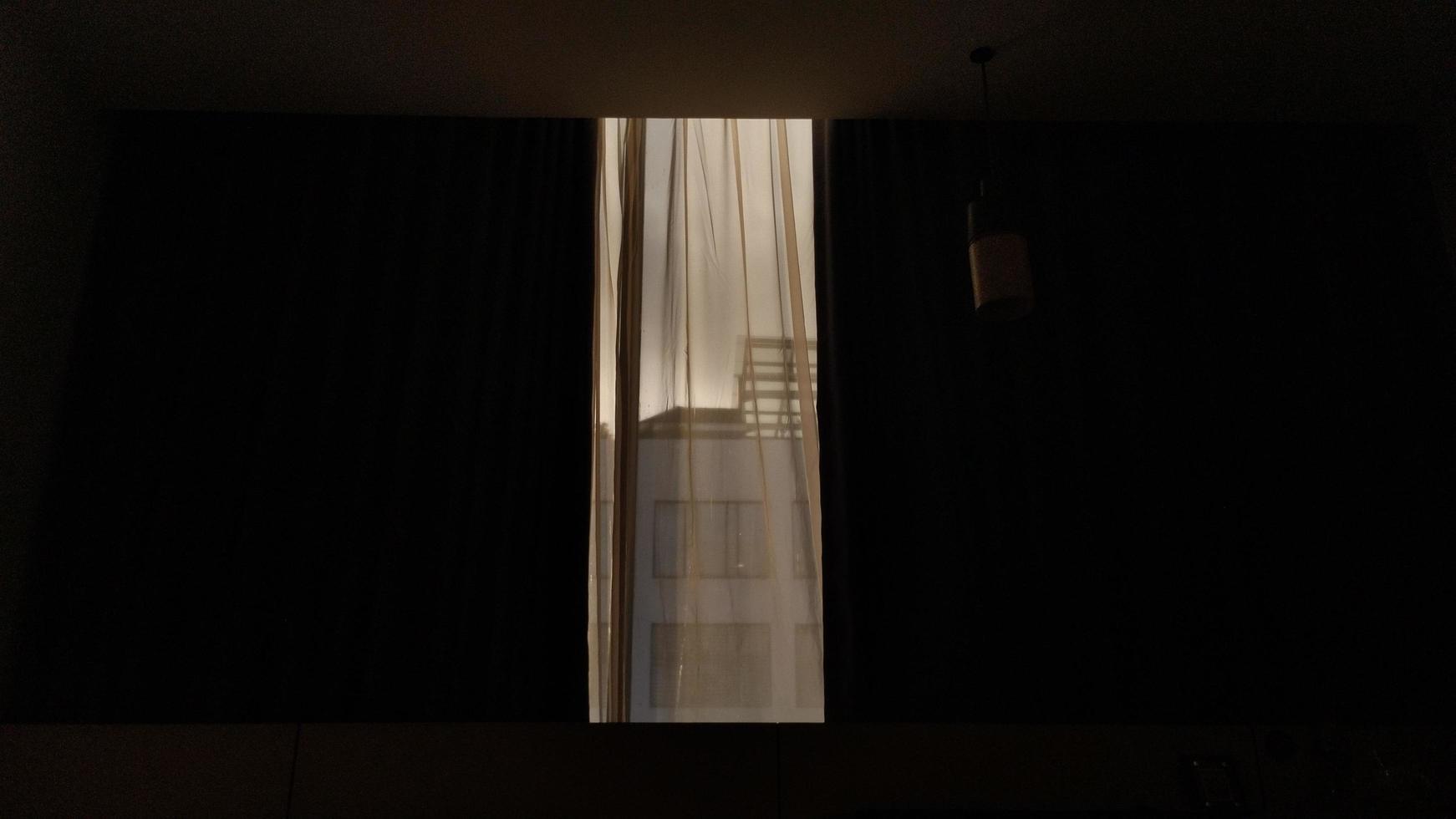 dark hotel room with yellow bulb light photo