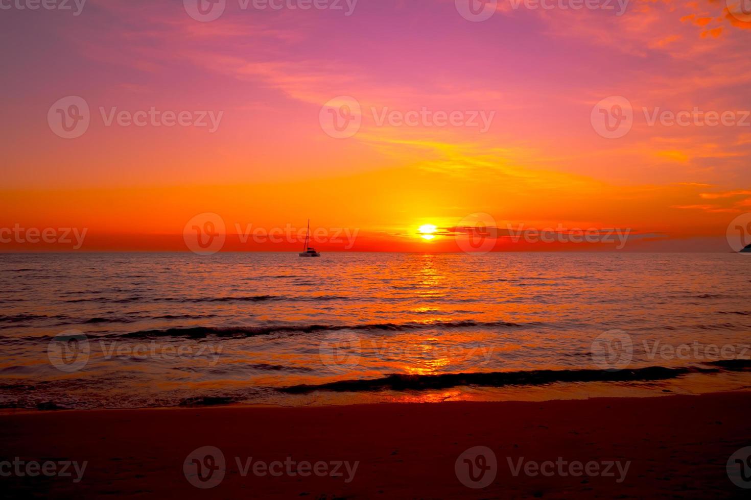 Beautiful sunset on the beach,sky on twilight time and reflection on the sea photo