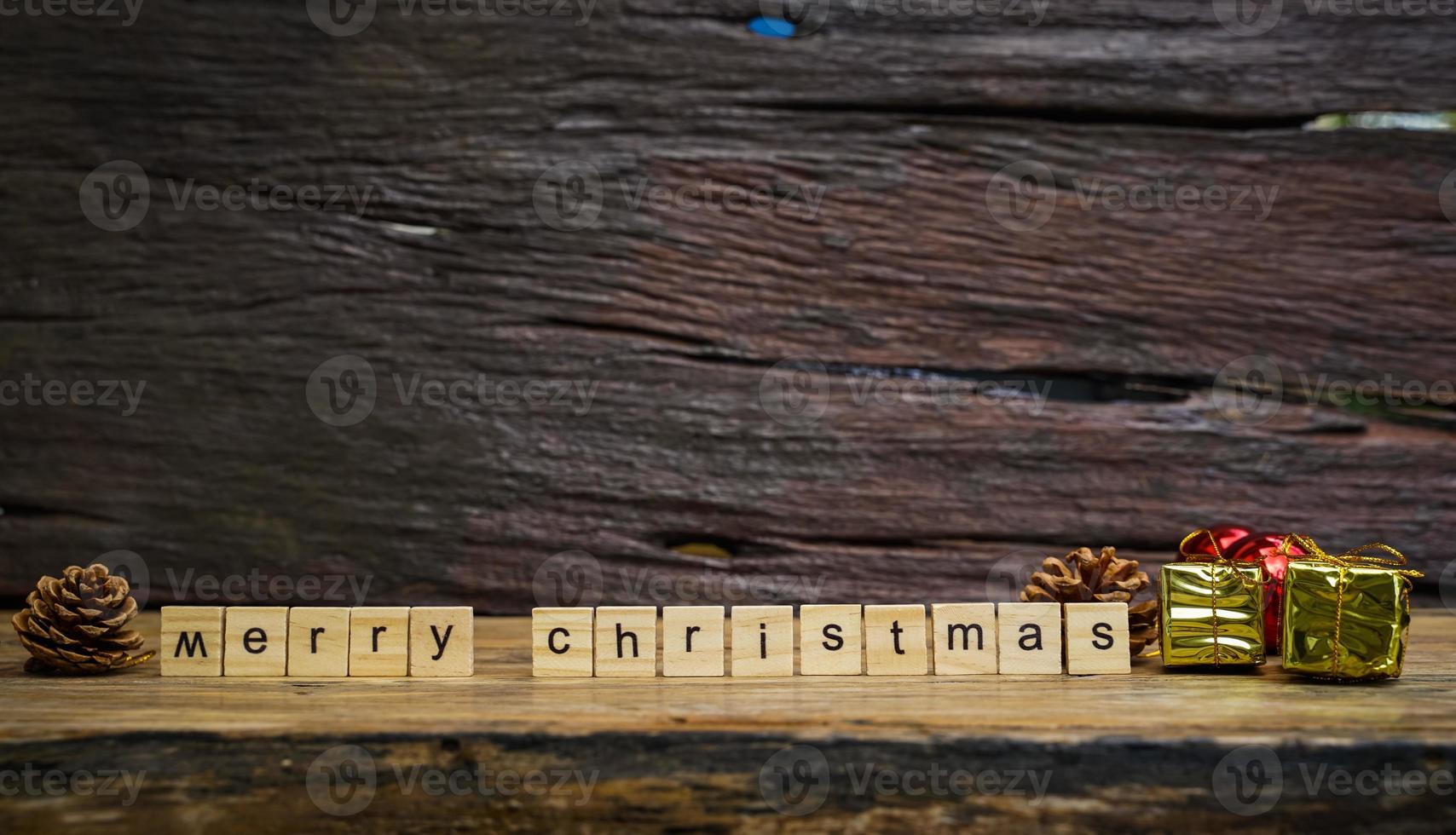 Merry Christmas.  wooden letters merry christmas word  on old wooden background photo