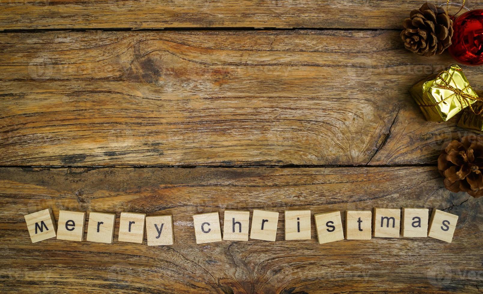 Merry Christmas.  wooden letters merry christmas word  on old wooden background photo