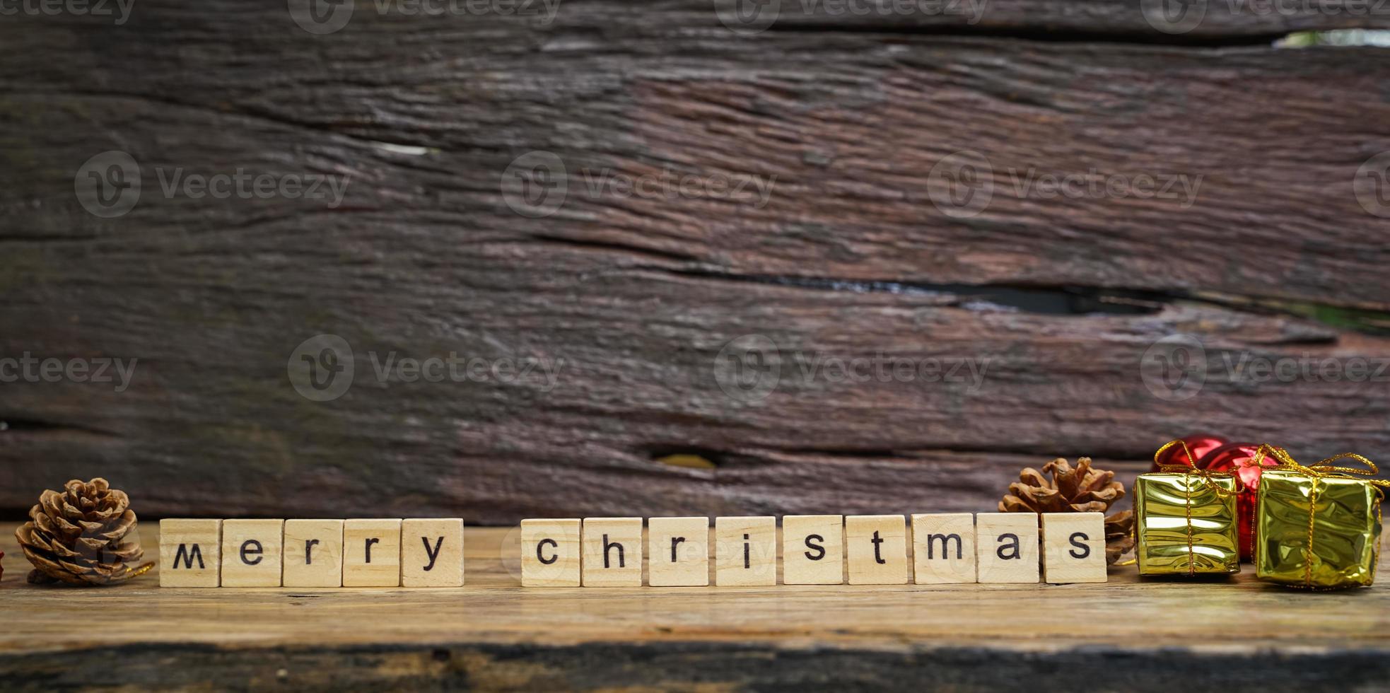 Merry Christmas.  wooden letters merry christmas word  on old wooden background photo