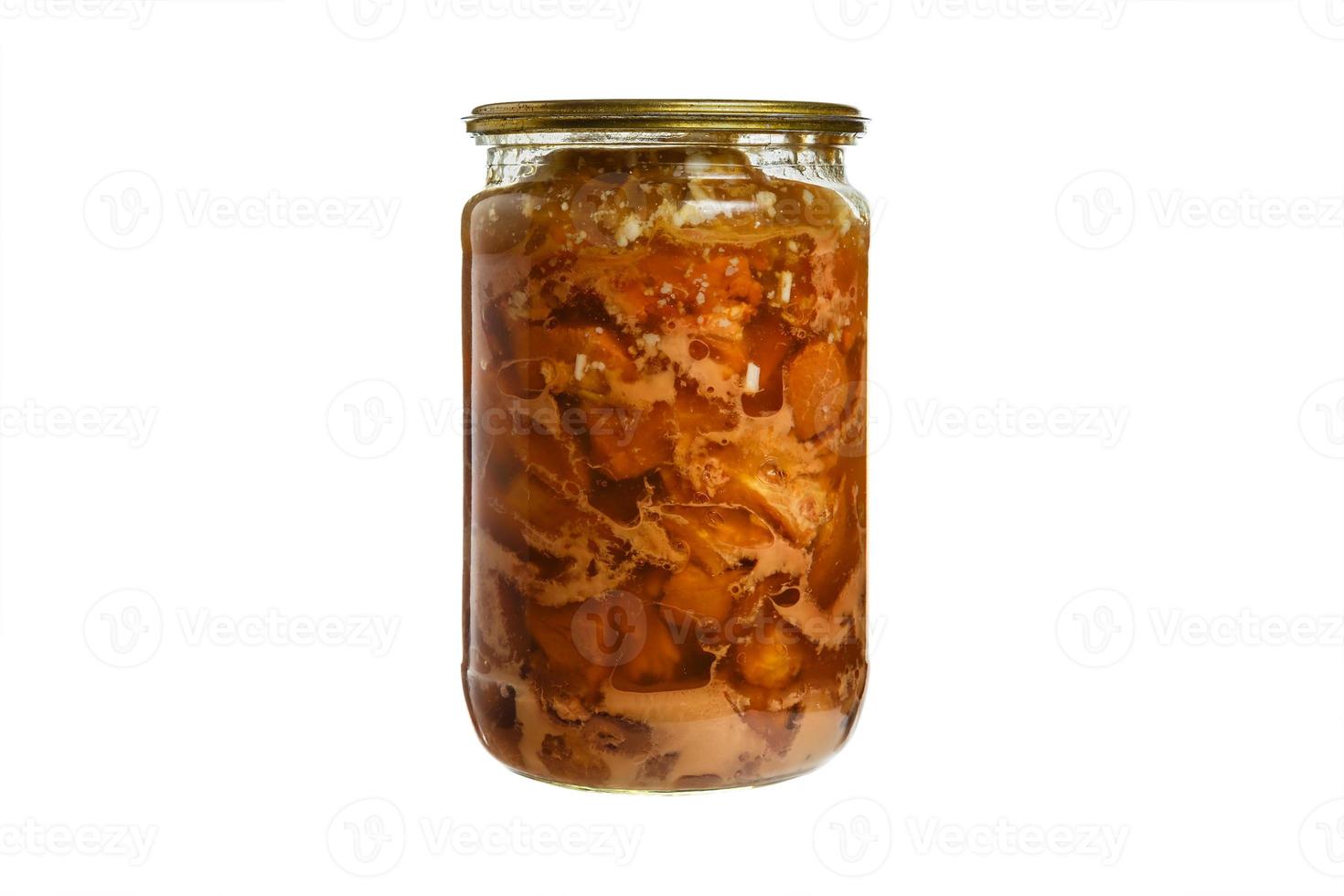 Canned meat in a glass jar, isolated on white background photo