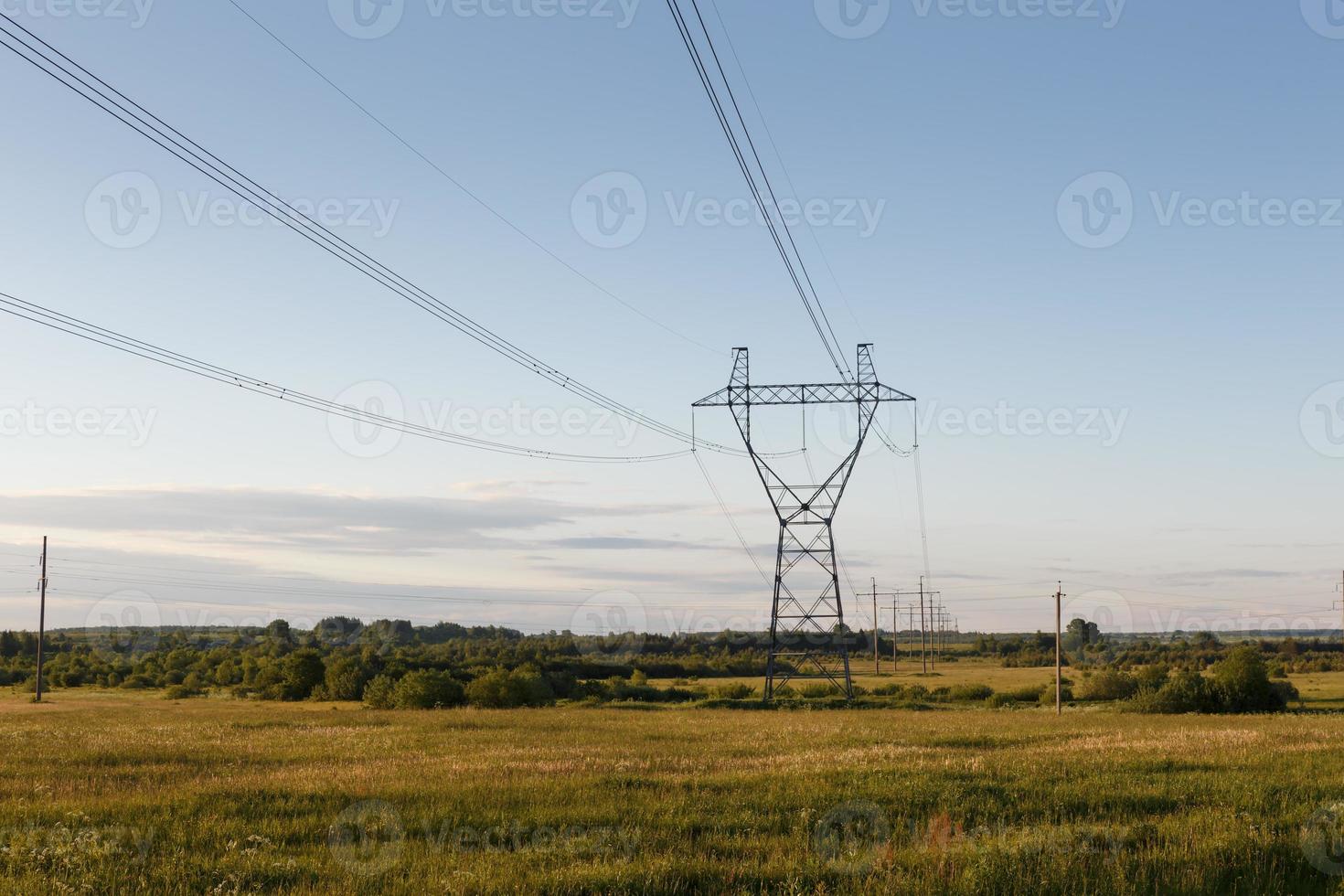 support of high-voltage power line in the field photo