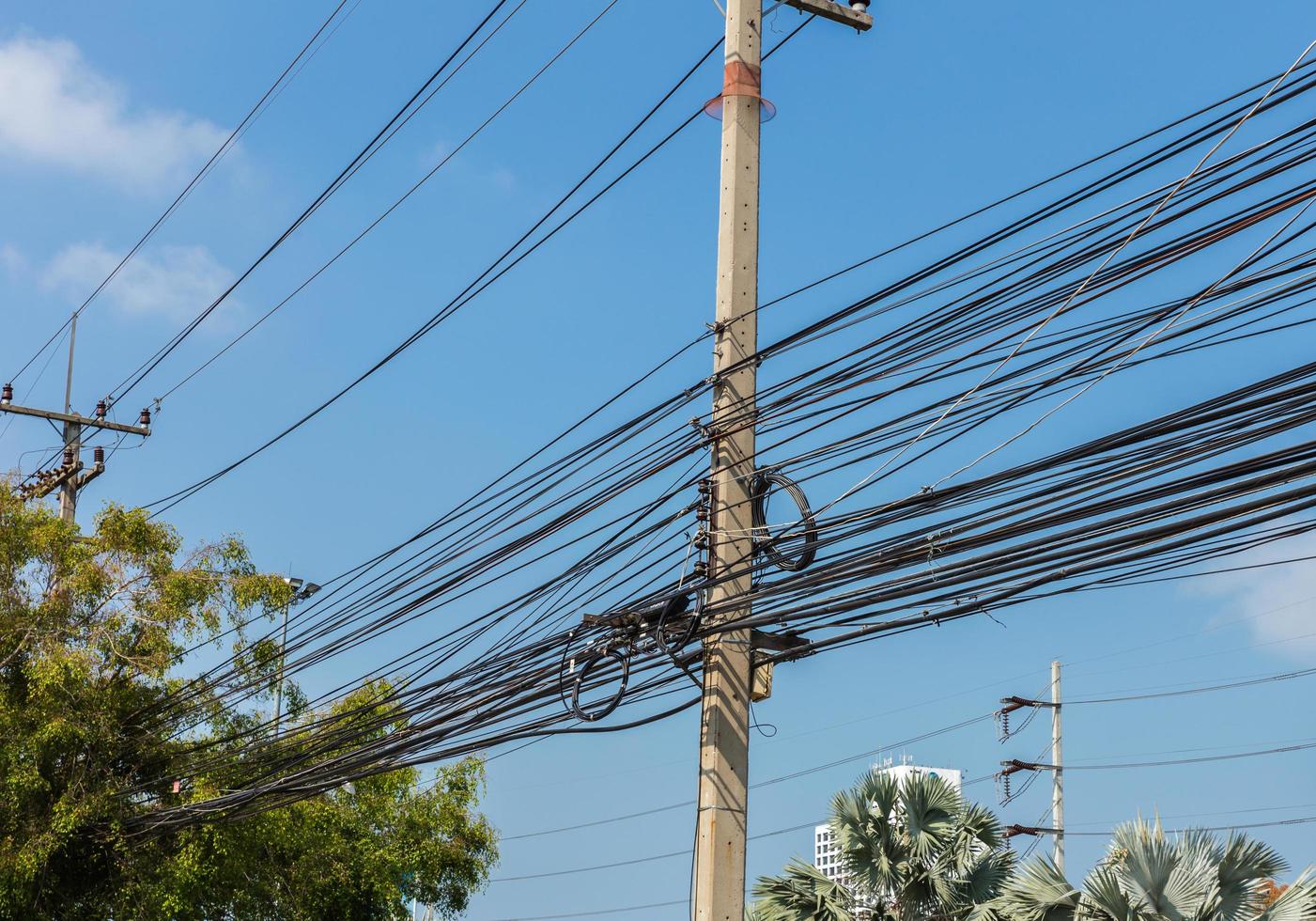 Electric pole power lines with blue sky,Thailand photo