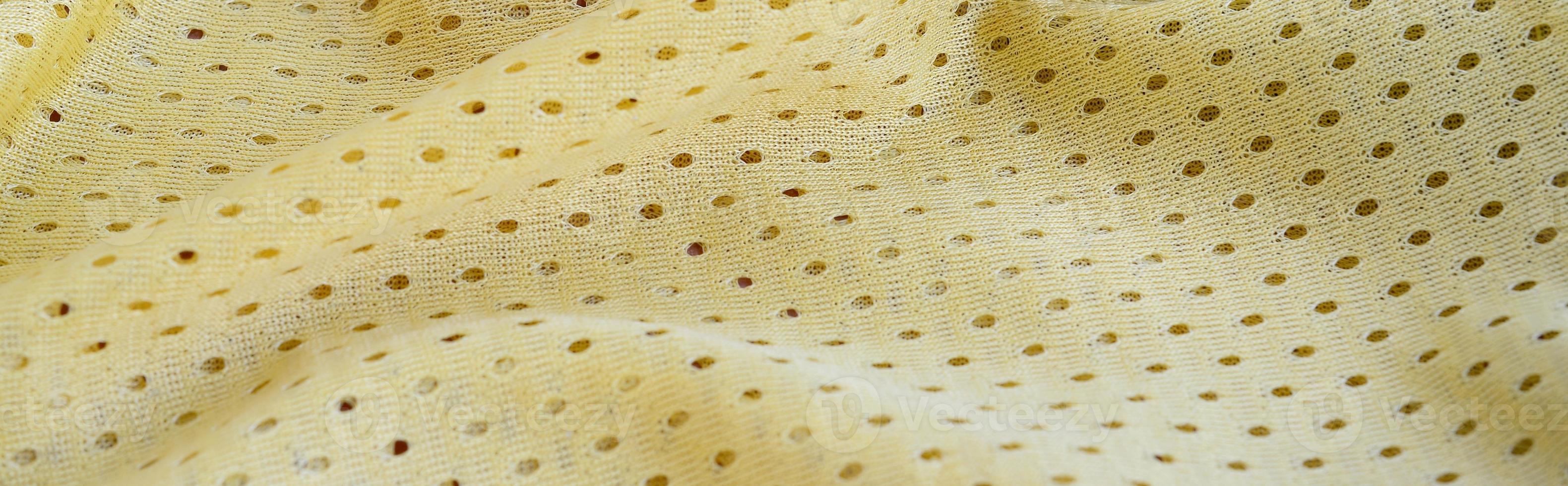 Yellow mesh sport wear fabric textile background pattern photo