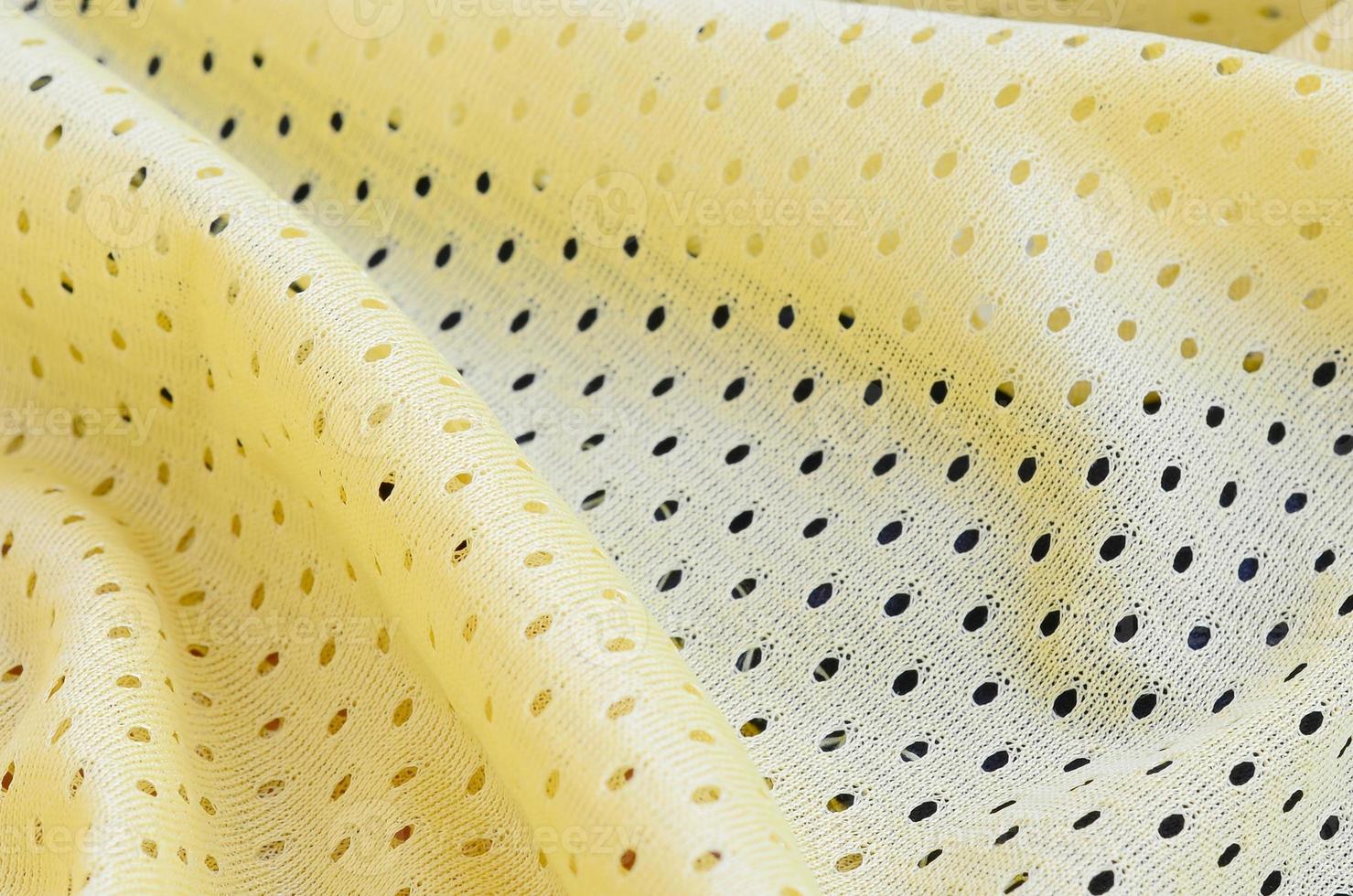 patrón de fondo textil de tela de desgaste deportivo de malla amarilla foto