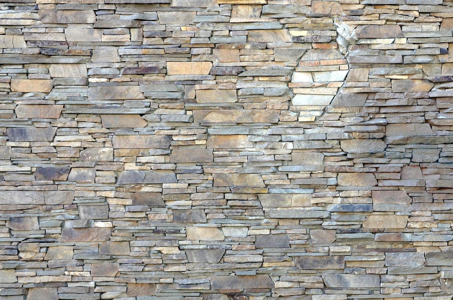 patrón moderno de superficies decorativas de paredes de piedra aplanadas en color marrón foto