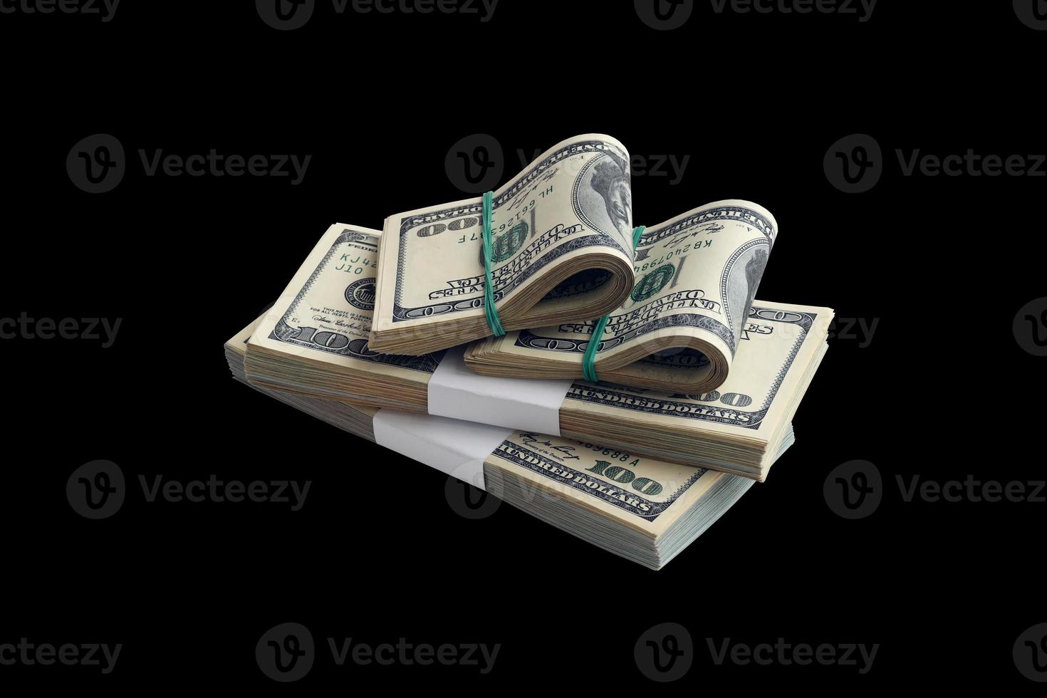 Bundle of US dollar bills isolated on black. Pack of american money with high resolution on perfect black background photo