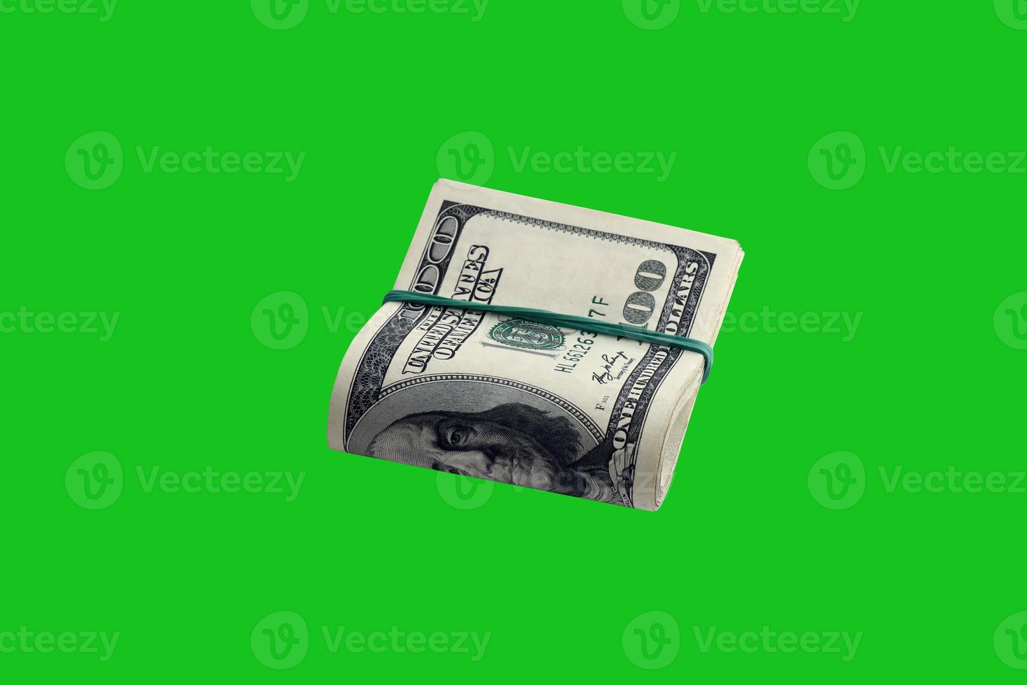 Bundle of US dollar bills isolated on chroma keyer green. Pack of american money with high resolution on perfect green mask photo