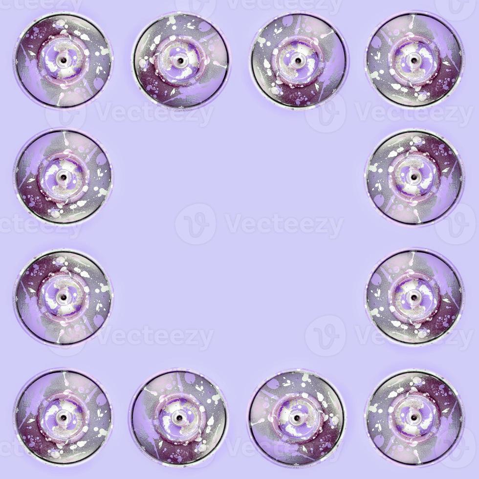 Many used spray cans for graffiti drawing lies on a pastel colored backgroung. Street art painting concept. Minimal flat lay pattern. Top view photo