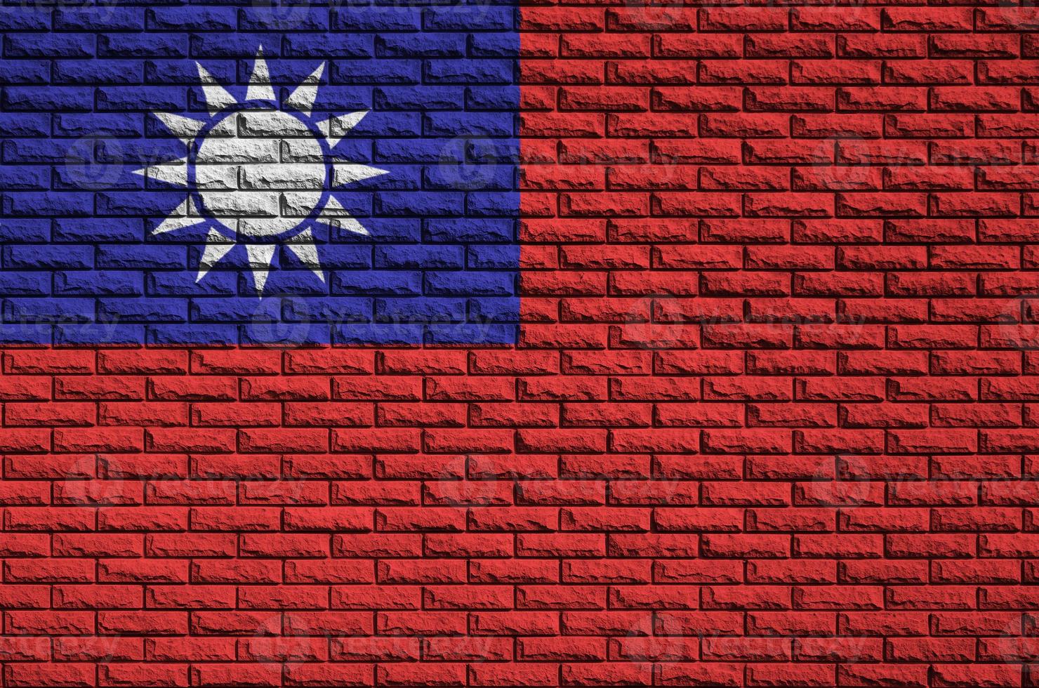 Taiwan flag is painted onto an old brick wall photo