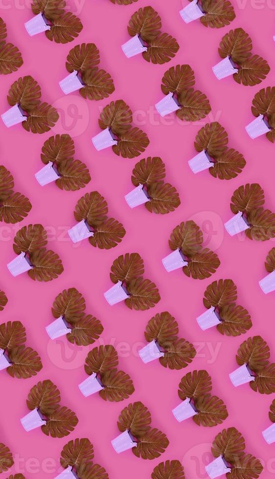 Tropical palm monstera leaves lies in a pastel pails on a colored background. Flat lay trendy minimal pattern. Top view photo