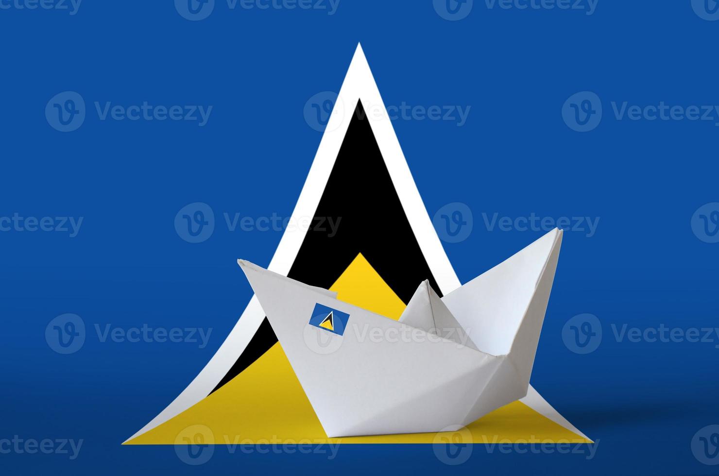Saint Lucia flag depicted on paper origami ship closeup. Handmade arts concept photo