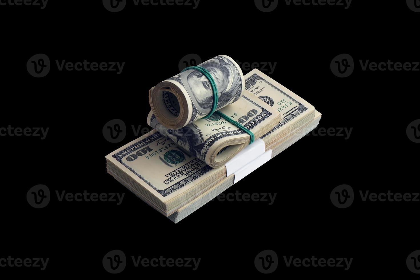 Bundle of US dollar bills isolated on black. Pack of american money with high resolution on perfect black background photo