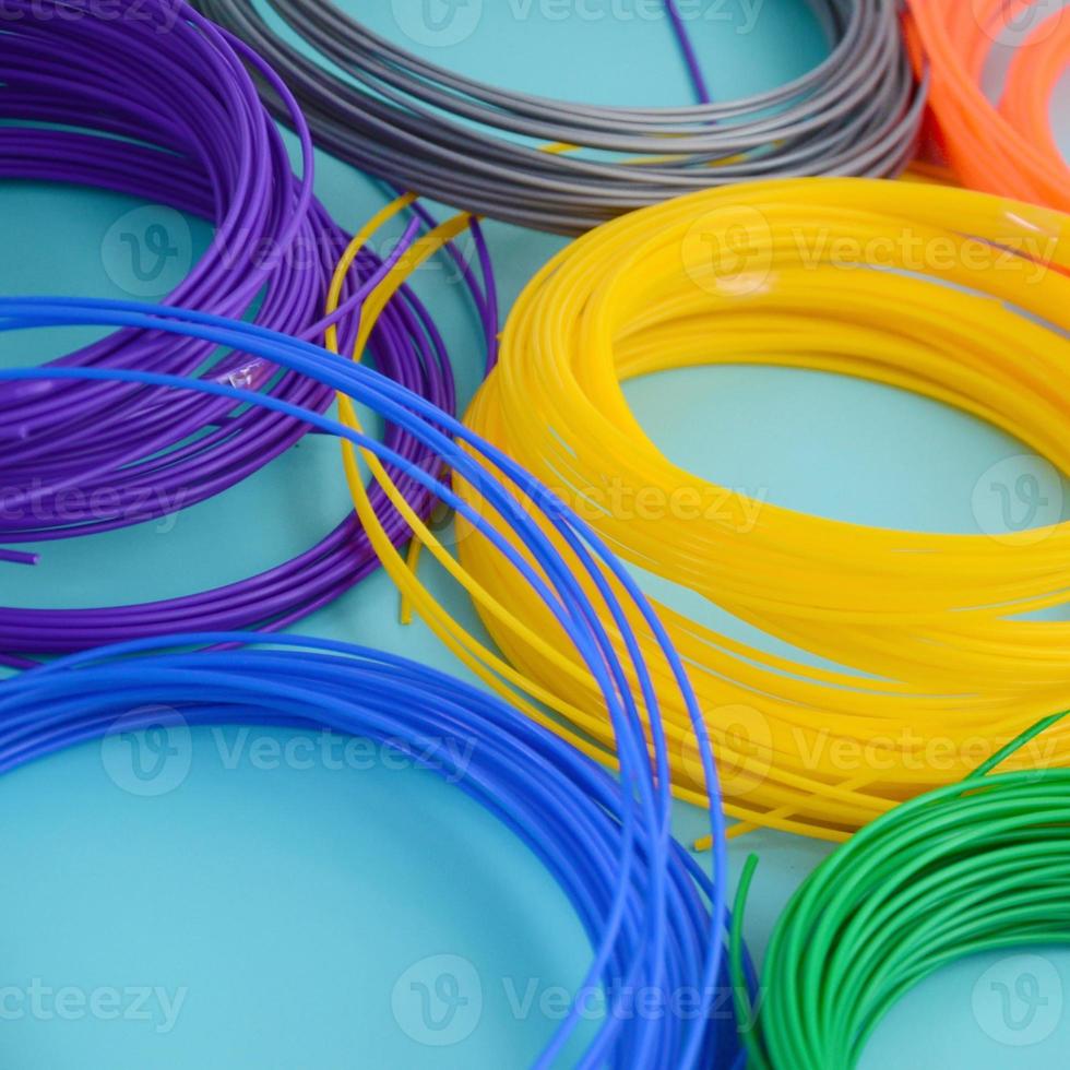 Plastic PLA and ABS filament material for printing on a 3D pen or printer of various colors photo