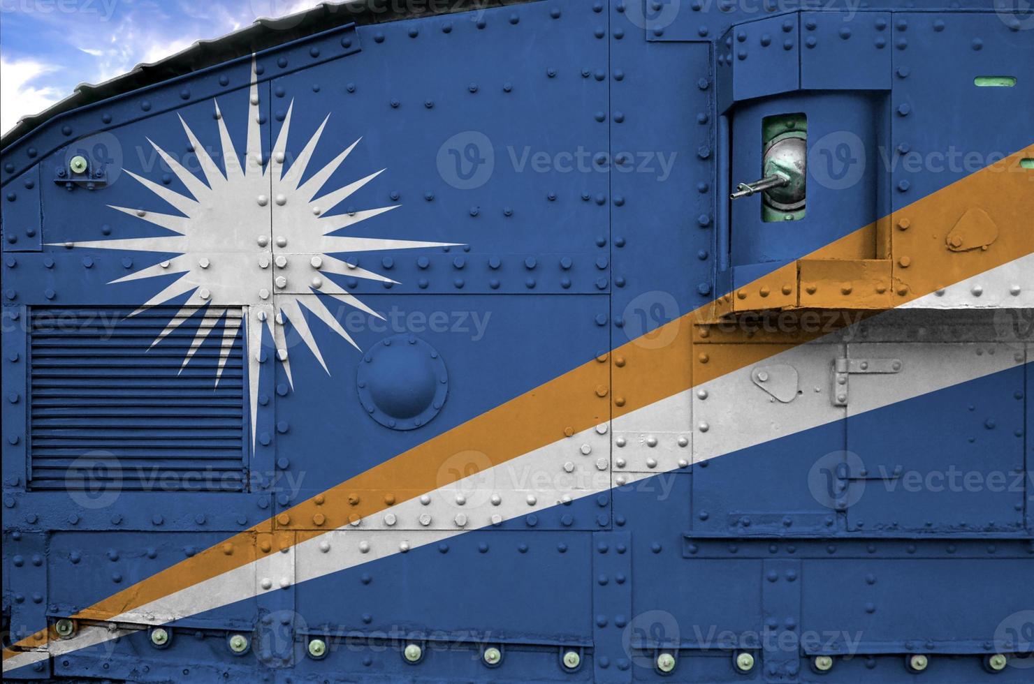 Marshall Islands flag depicted on side part of military armored tank closeup. Army forces conceptual background photo