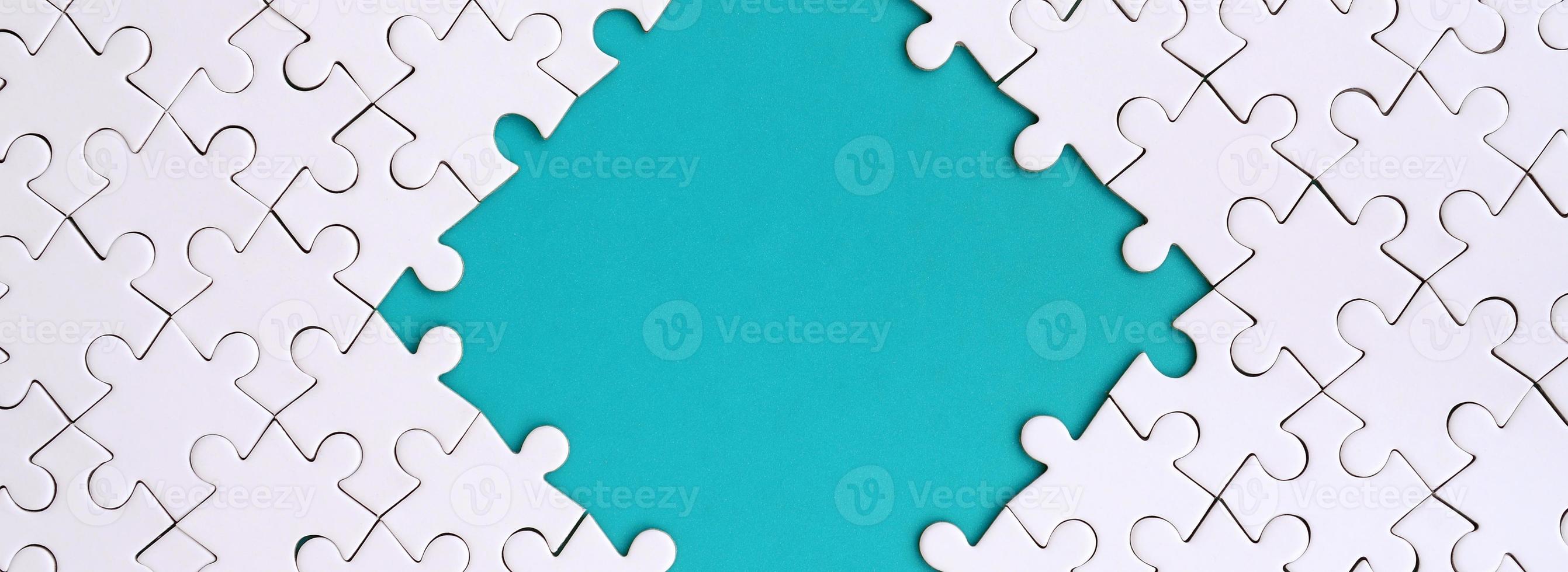 Framing in the form of a rhombus, made of a white jigsaw puzzle around the blue space photo