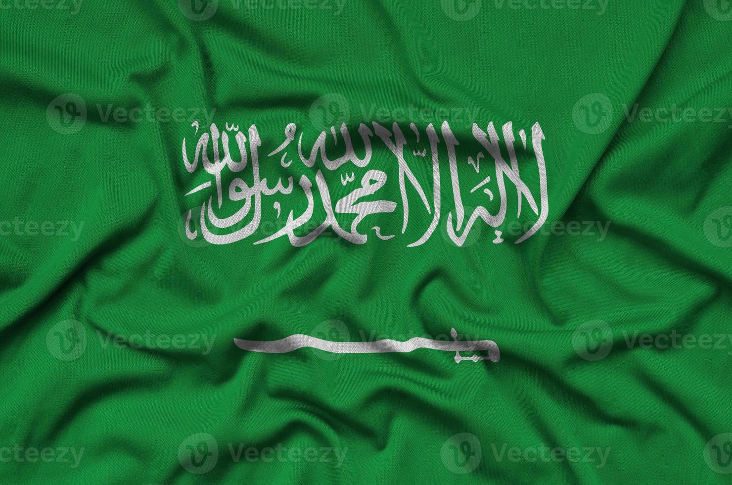 Saudi Arabia flag  is depicted on a sports cloth fabric with many folds. Sport team banner photo
