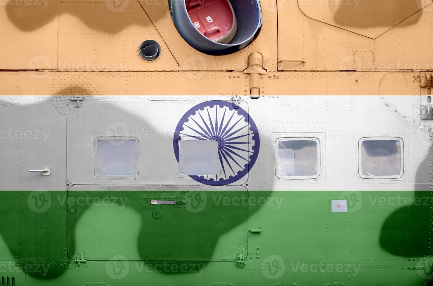 India flag depicted on side part of military armored helicopter closeup. Army forces aircraft conceptual background photo