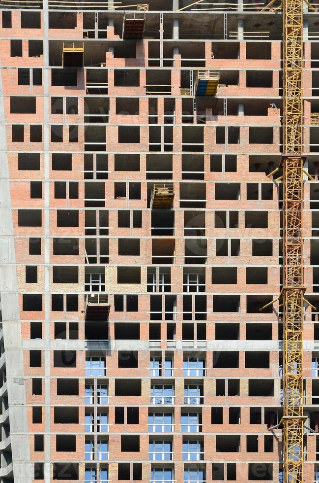 Residential multi store apartement building house facade under construction photo