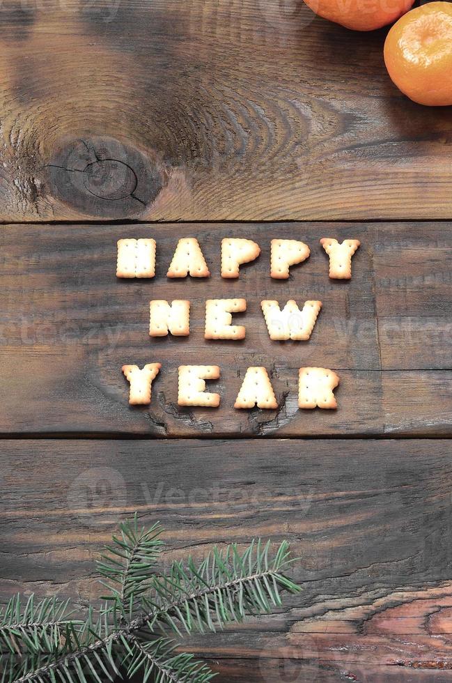 Tangerines, cracker text and fir branches with copy space photo