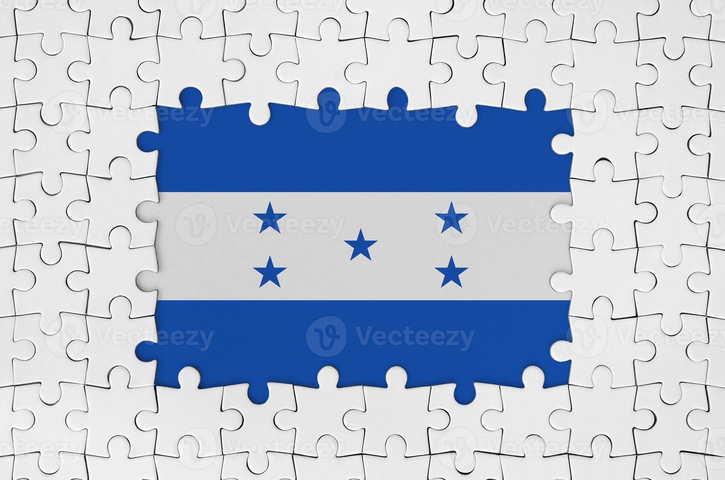 Honduras flag in frame of white puzzle pieces with missing central part photo
