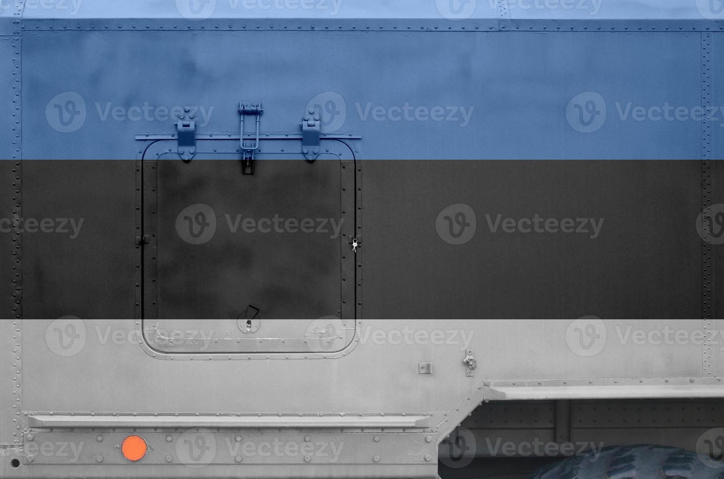 Estonia flag depicted on side part of military armored truck closeup. Army forces conceptual background photo