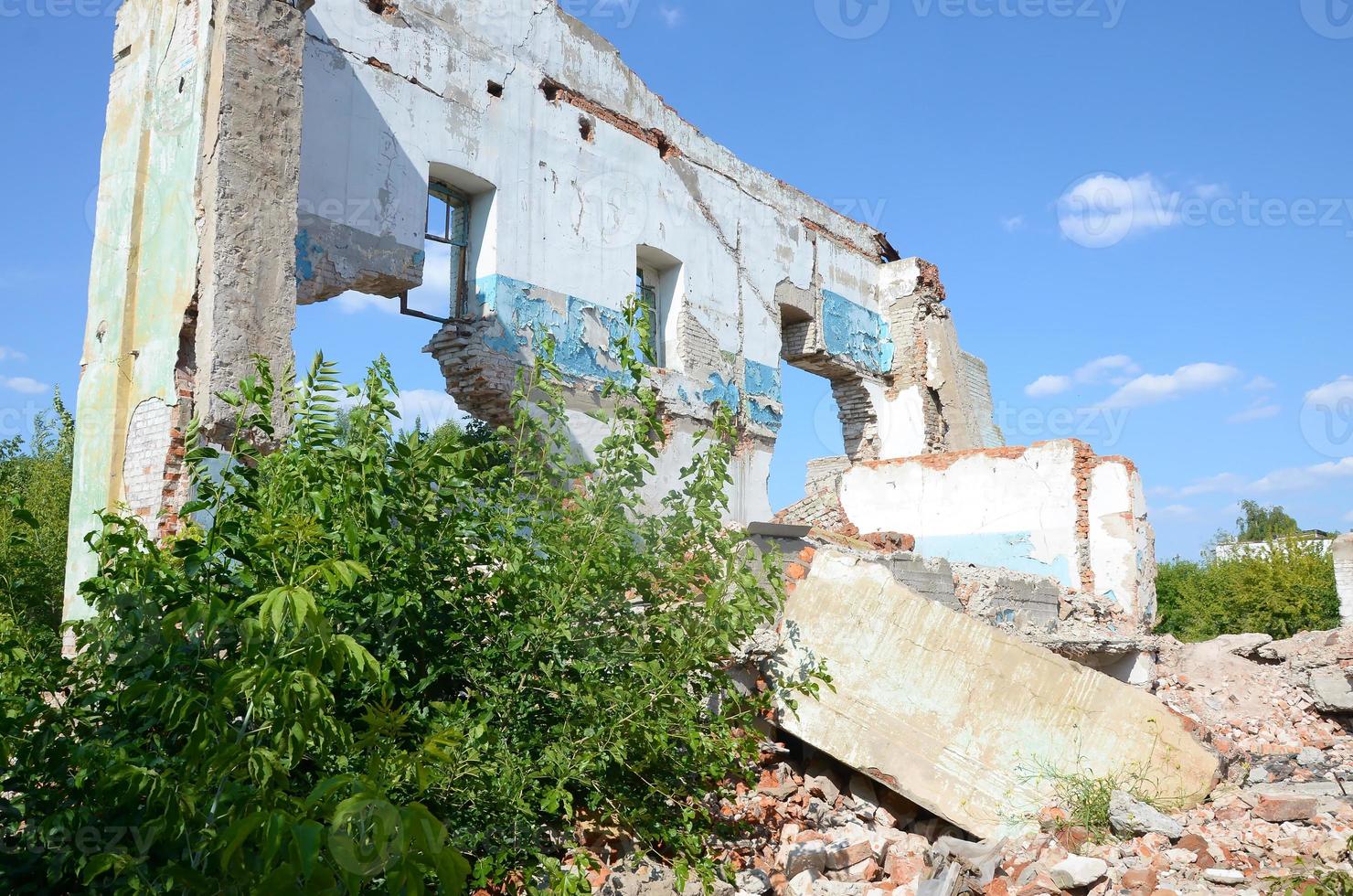 Collapsed industrial multistorey building in daytime photo