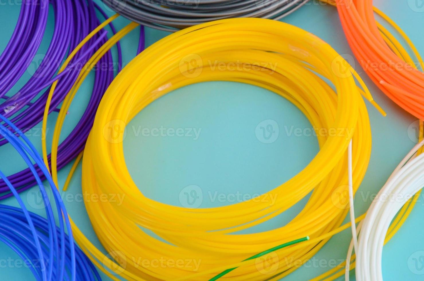 Plastic PLA and ABS filament material for printing on a 3D pen or printer of various colors photo