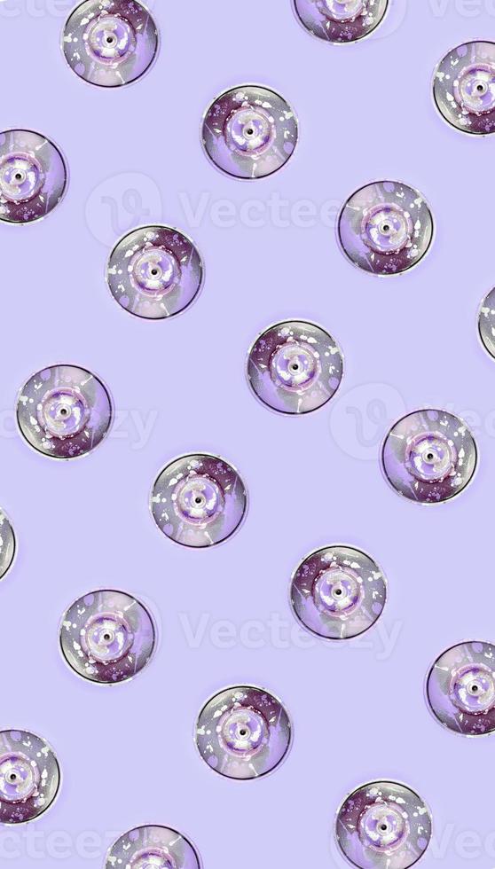 Many used spray cans for graffiti drawing lies on a pastel colored backgroung. Street art painting concept. Minimal flat lay pattern. Top view photo