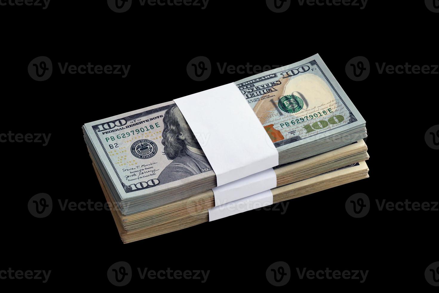 Bundle of US dollar bills isolated on black. Pack of american money with high resolution on perfect black background photo