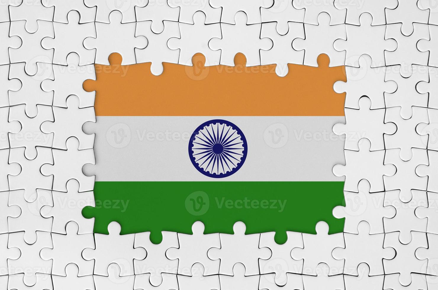 India flag in frame of white puzzle pieces with missing central part photo