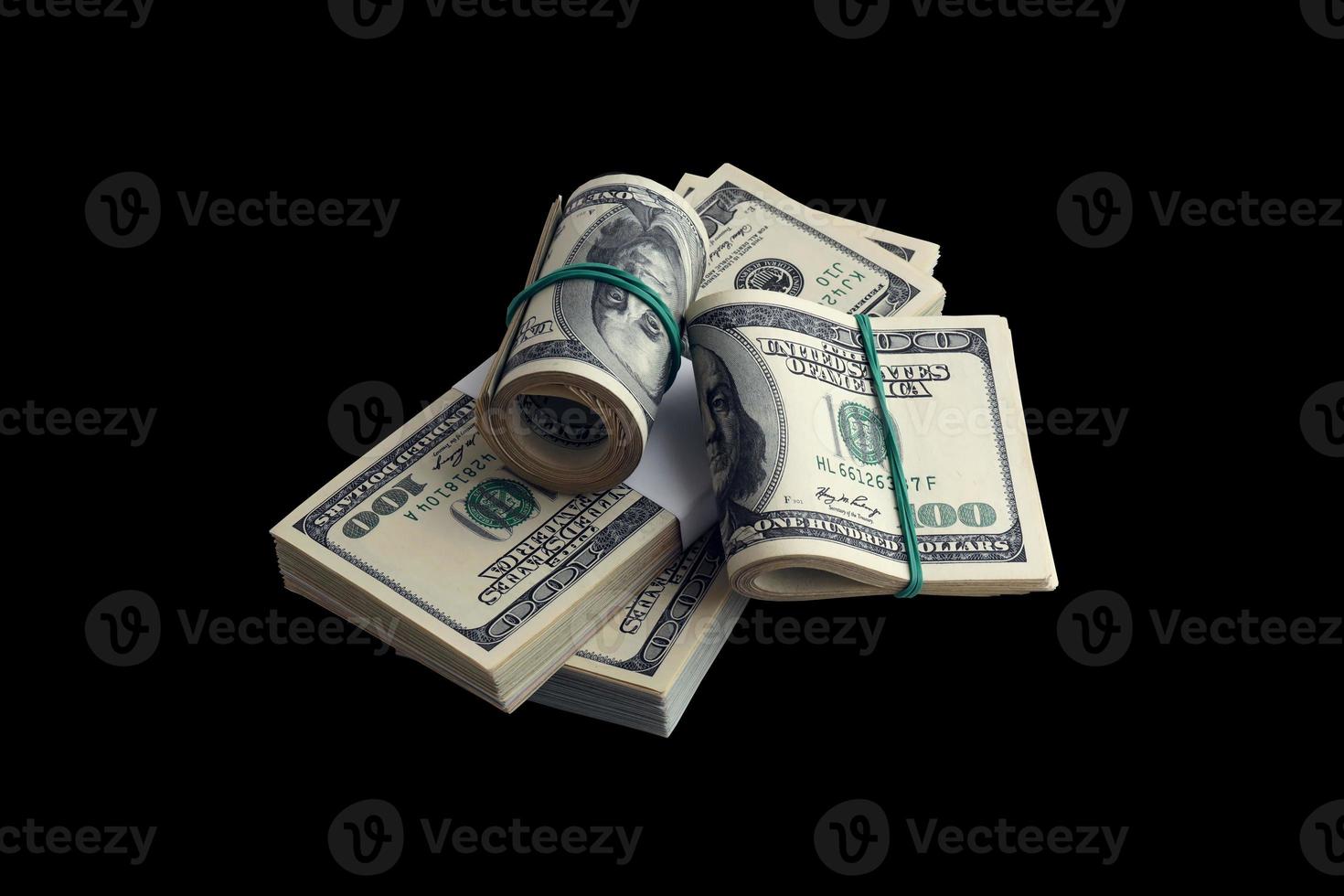 Bundle of US dollar bills isolated on black. Pack of american money with high resolution on perfect black background photo