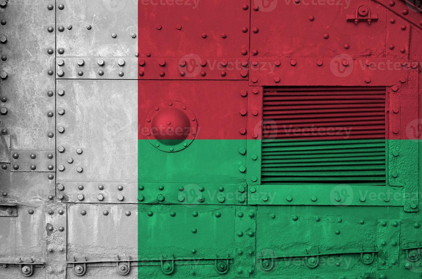 Madagascar flag depicted on side part of military armored tank closeup. Army forces conceptual background photo