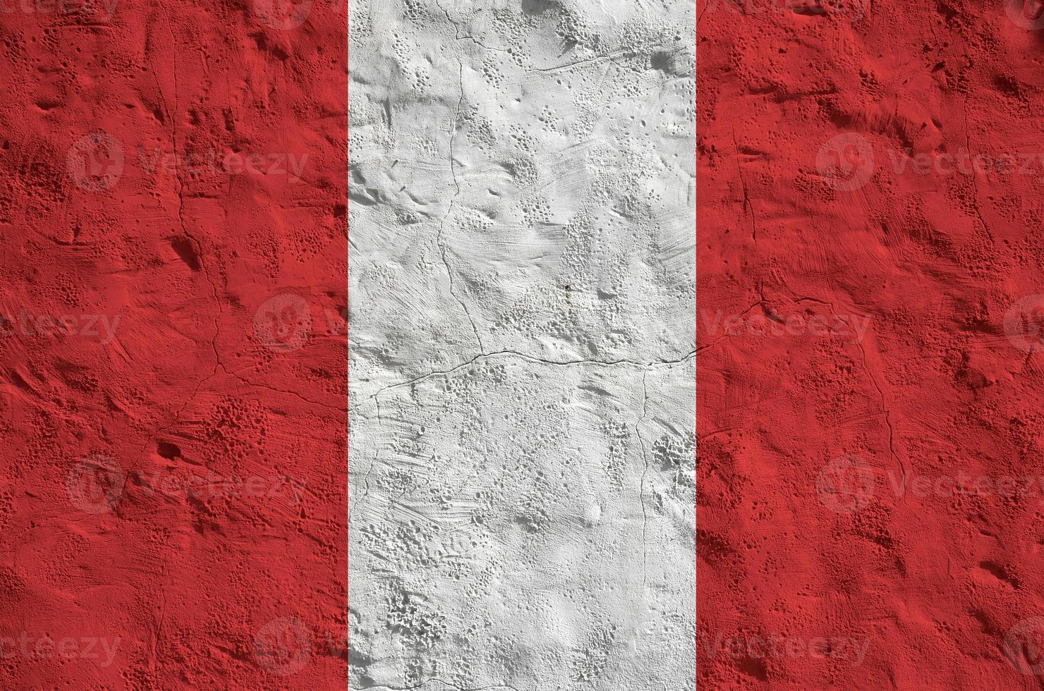 Peru flag depicted in bright paint colors on old relief plastering wall. Textured banner on rough background photo