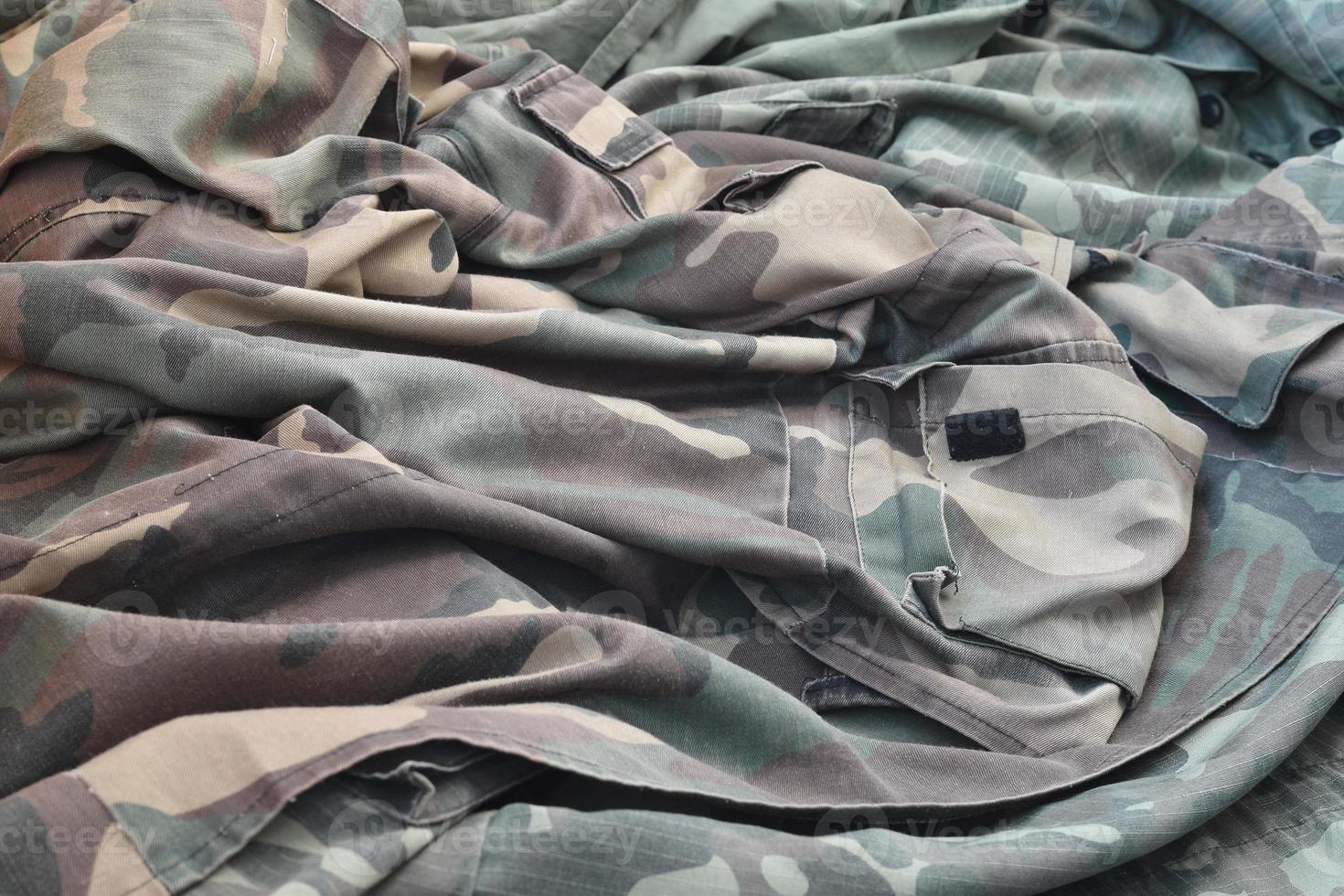 Camouflage background texture as backdrop for army and military design projects photo