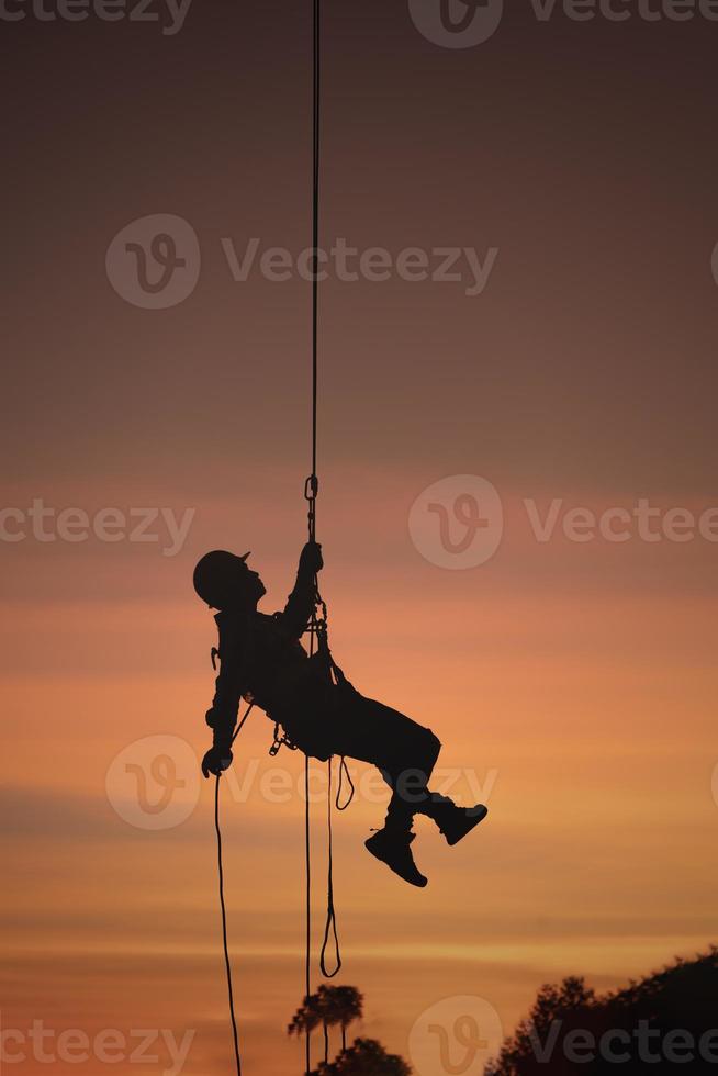 Rescue on a rope in the sunset photo