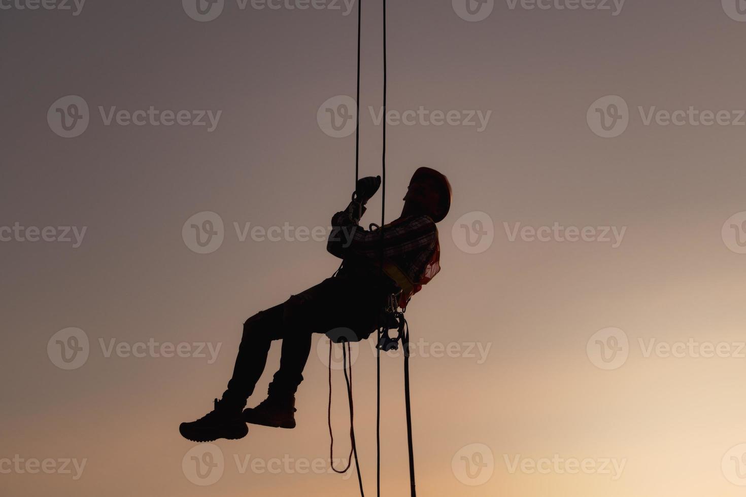 rope access, foreman operation control training the abseiling from the height silhouette photo