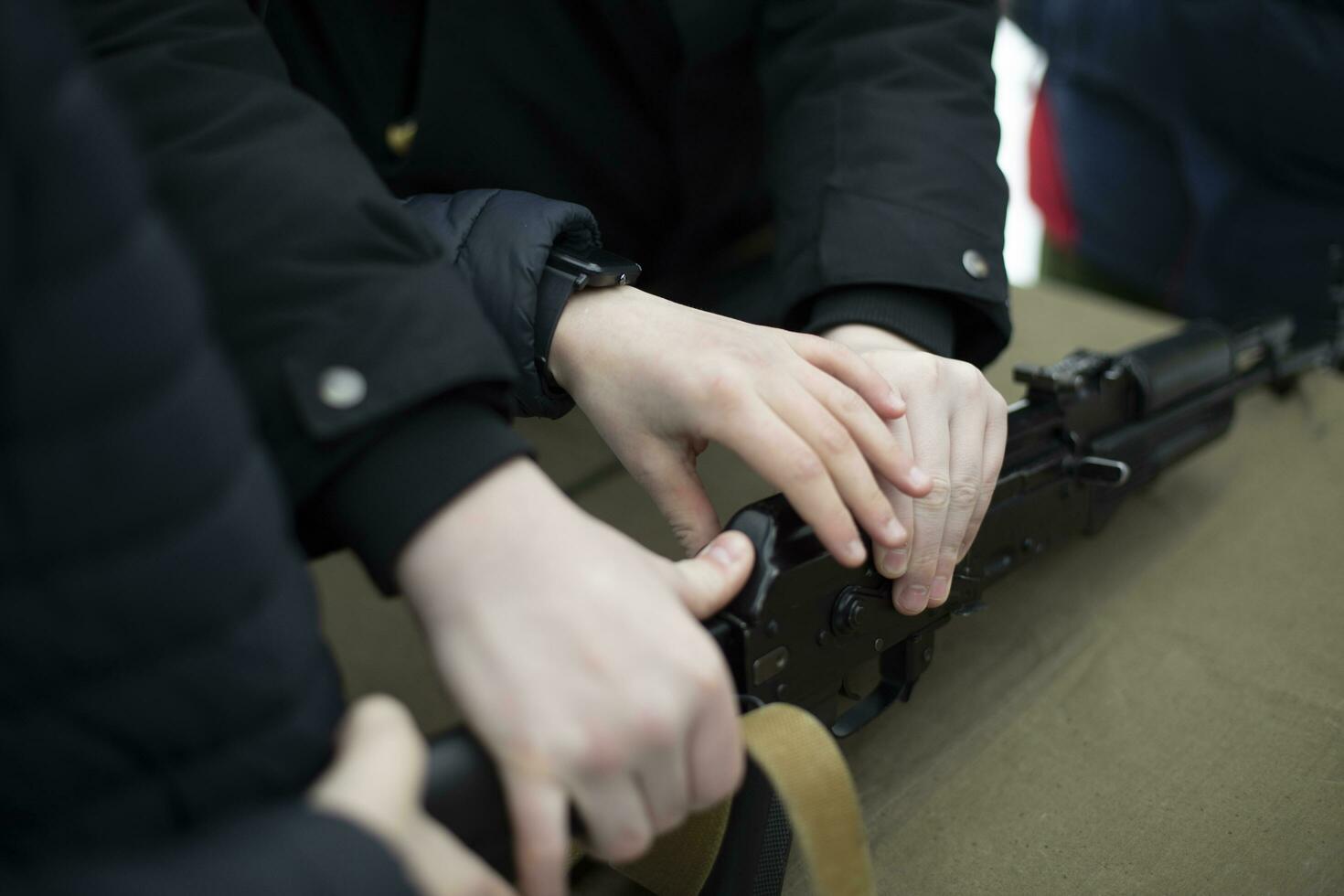 Shooting training. Dismantling of training weapons. Training of volunteers in Russia. Assembly of firearms. photo