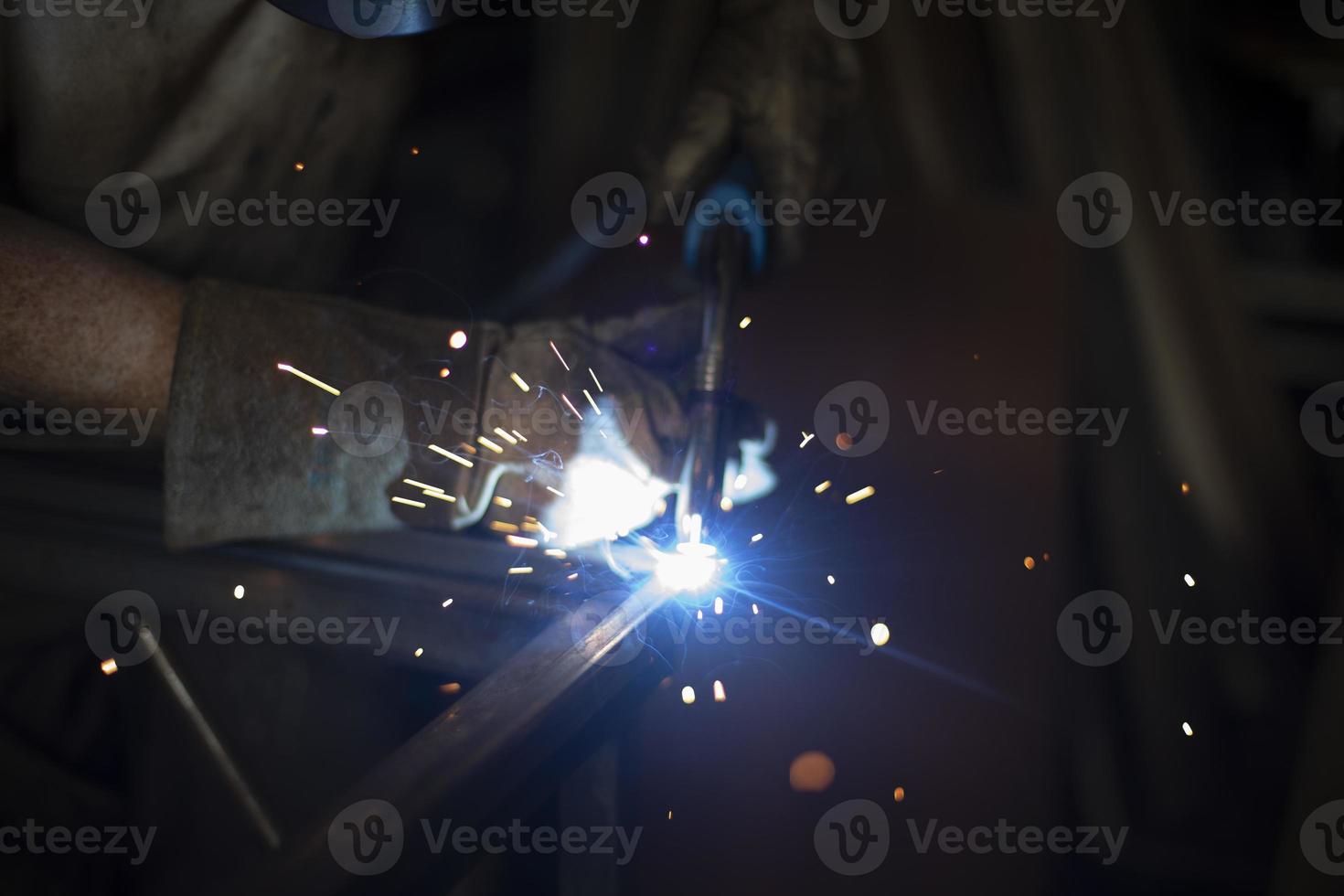 Steel welding. Metal seam welding. High temperature blue. photo