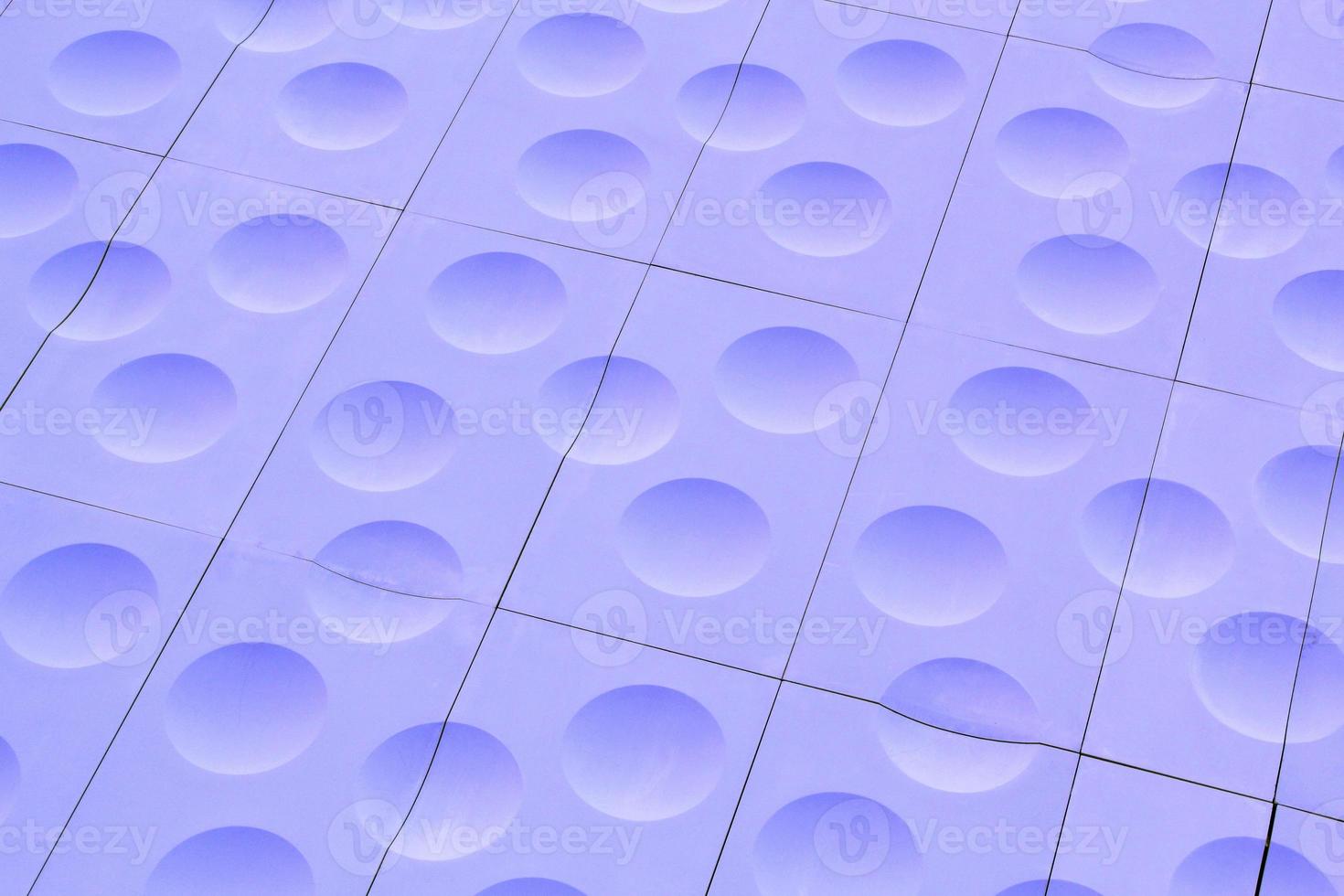 The close-up of violet detailed sphere texture reverse side of the plastic tile. Rough embossed lattice. Concept of design. Wall decoration interior. Relief balls geometric pattern. Flatlay, mock up photo