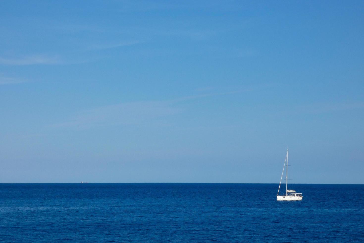 Sailboat sailing in the mediterranean sea, calm waters photo