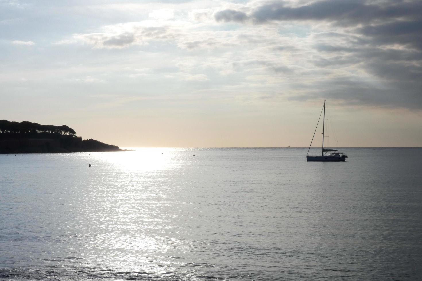 Sailboat sailing in the mediterranean sea, calm waters photo