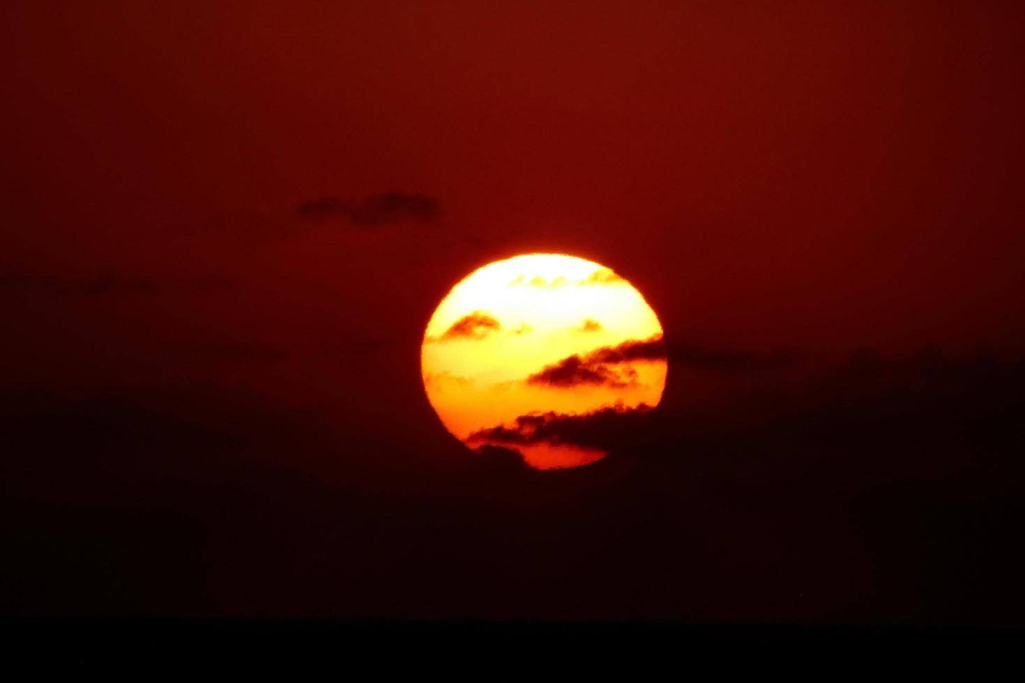 Sun disk rising over the horizon of the sea, sunrise, dawn photo