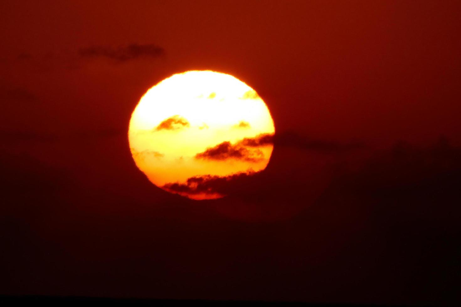 Sun disk rising over the horizon of the sea, sunrise, dawn photo